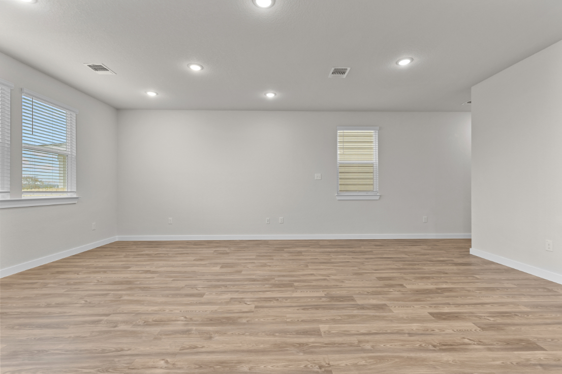 A room with a wood floor and a wood floor.