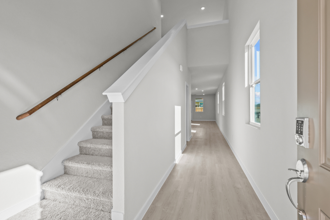 A long hallway with white walls.