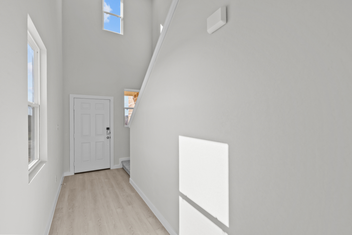 A hallway with white walls.