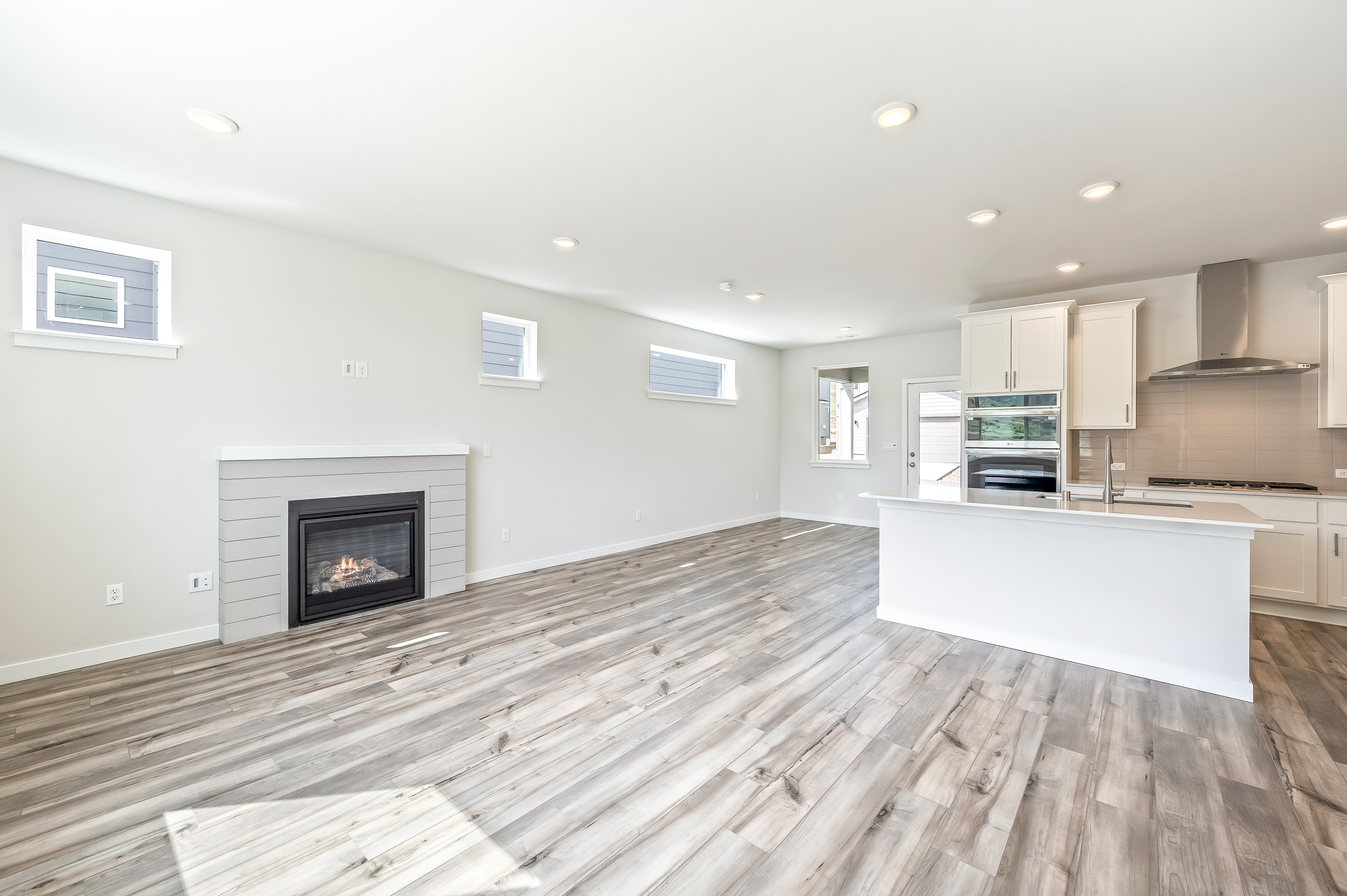 A kitchen with a fireplace.