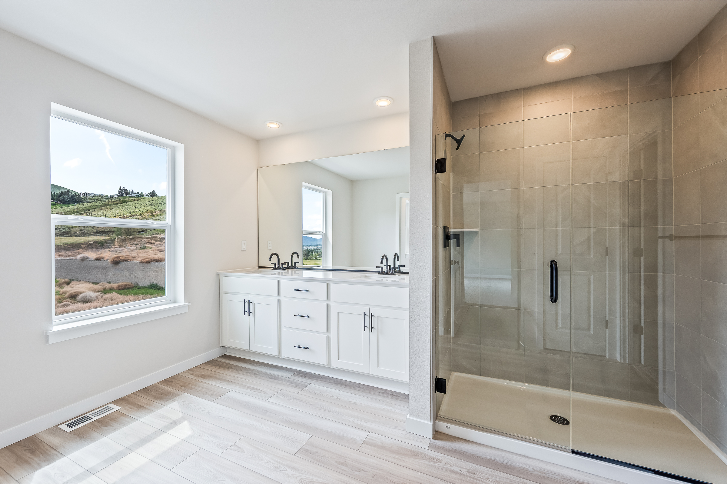 A bathroom with a glass shower.