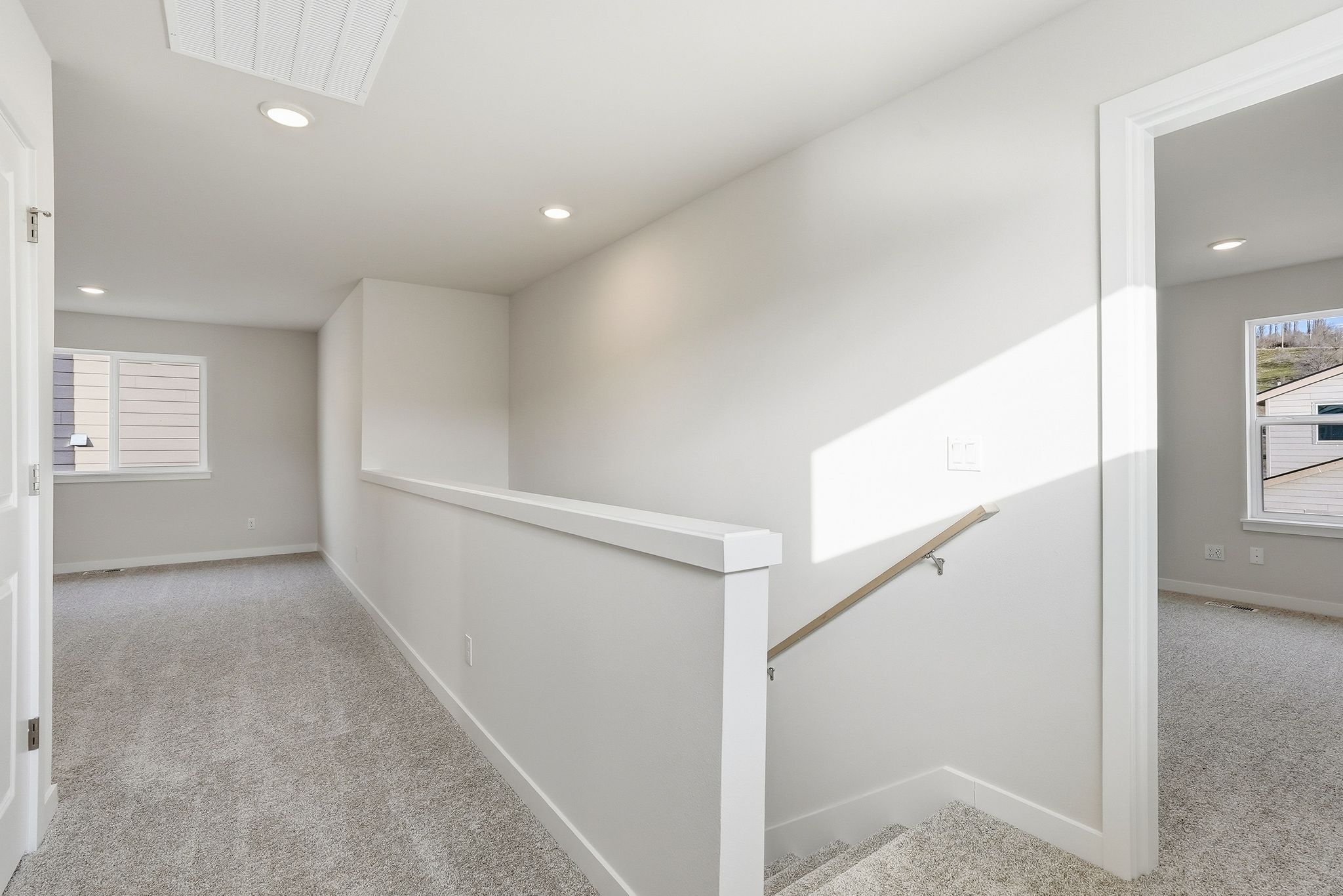 A room with a white wall and a white floor.