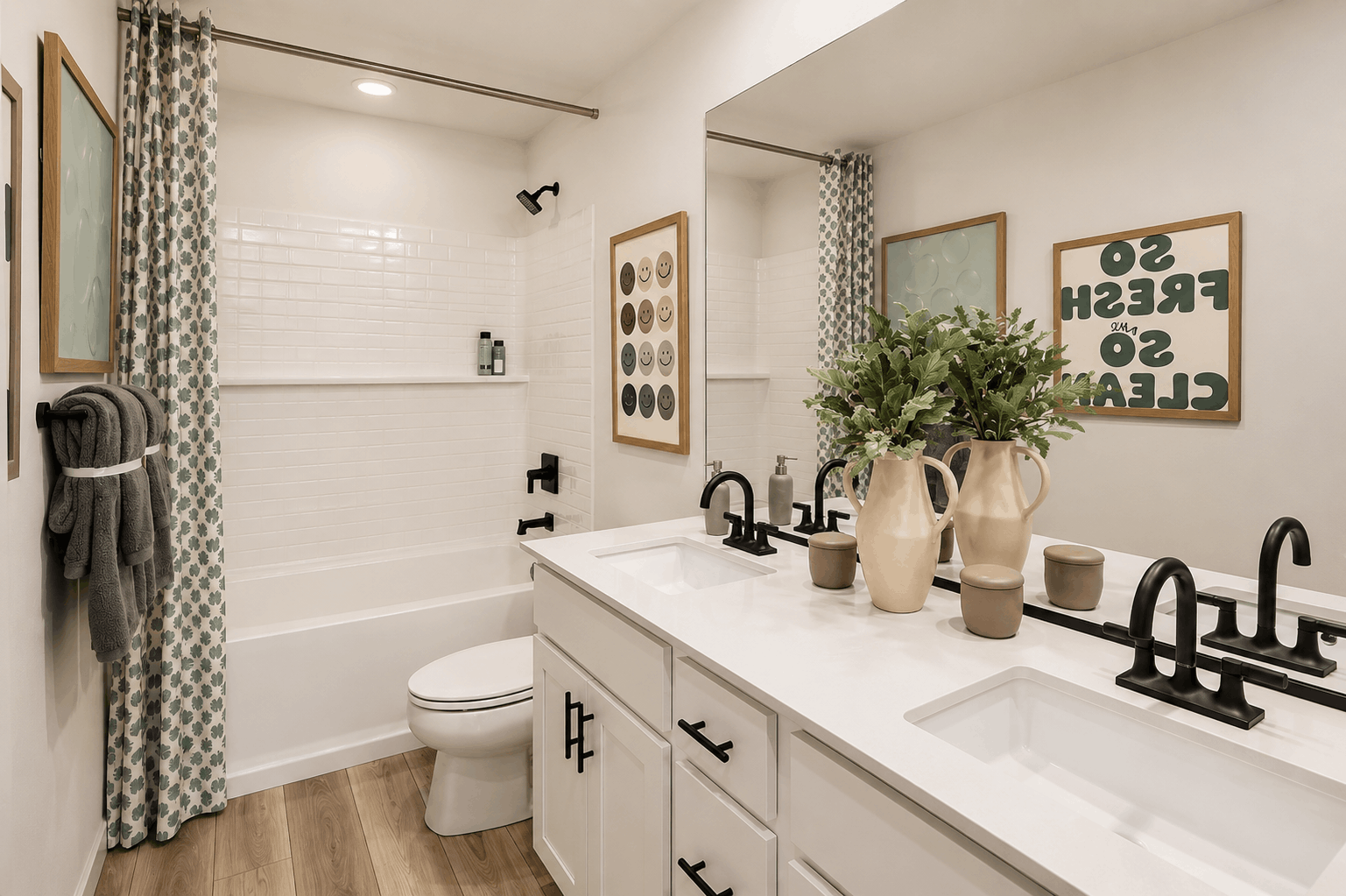 A bathroom with a tub sink and toilet.