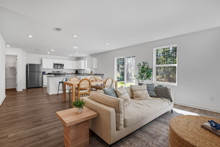 A living room with a couch and a table.