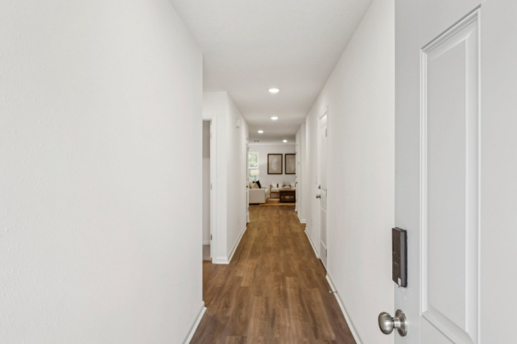 A hallway with white doors.