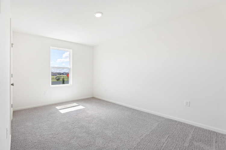 A room with a painting on the wall.