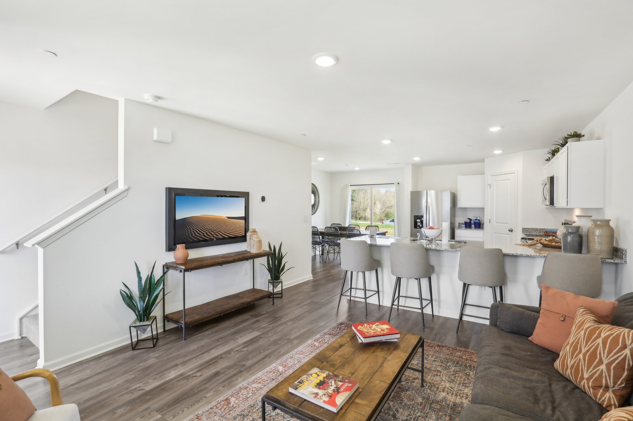 A living room with a tv and couches.