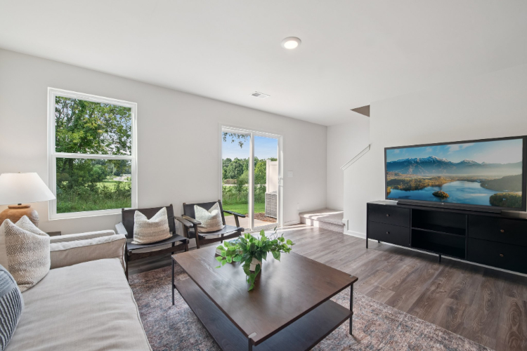 A living room with a large television.
