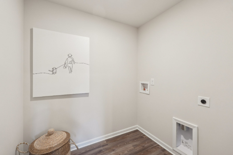 A room with a drawing on the wall.