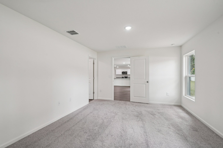 A hallway with white walls.