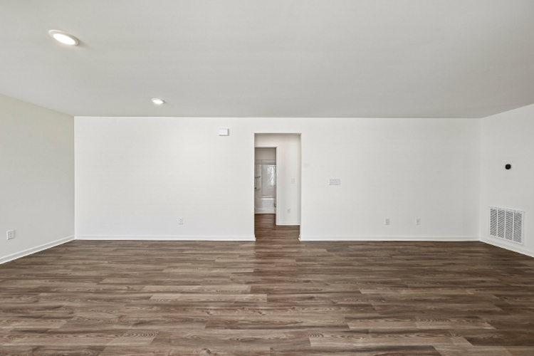 A room with a wood floor and a wood floor.