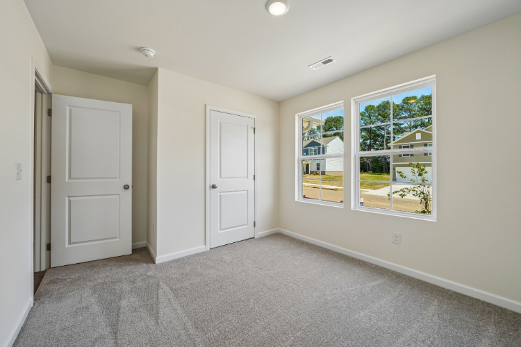 A room with white doors and windows.