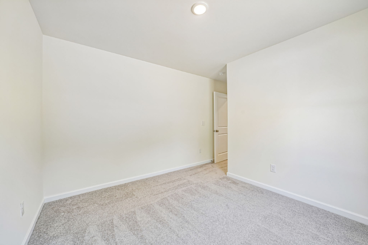 A hallway with a door.