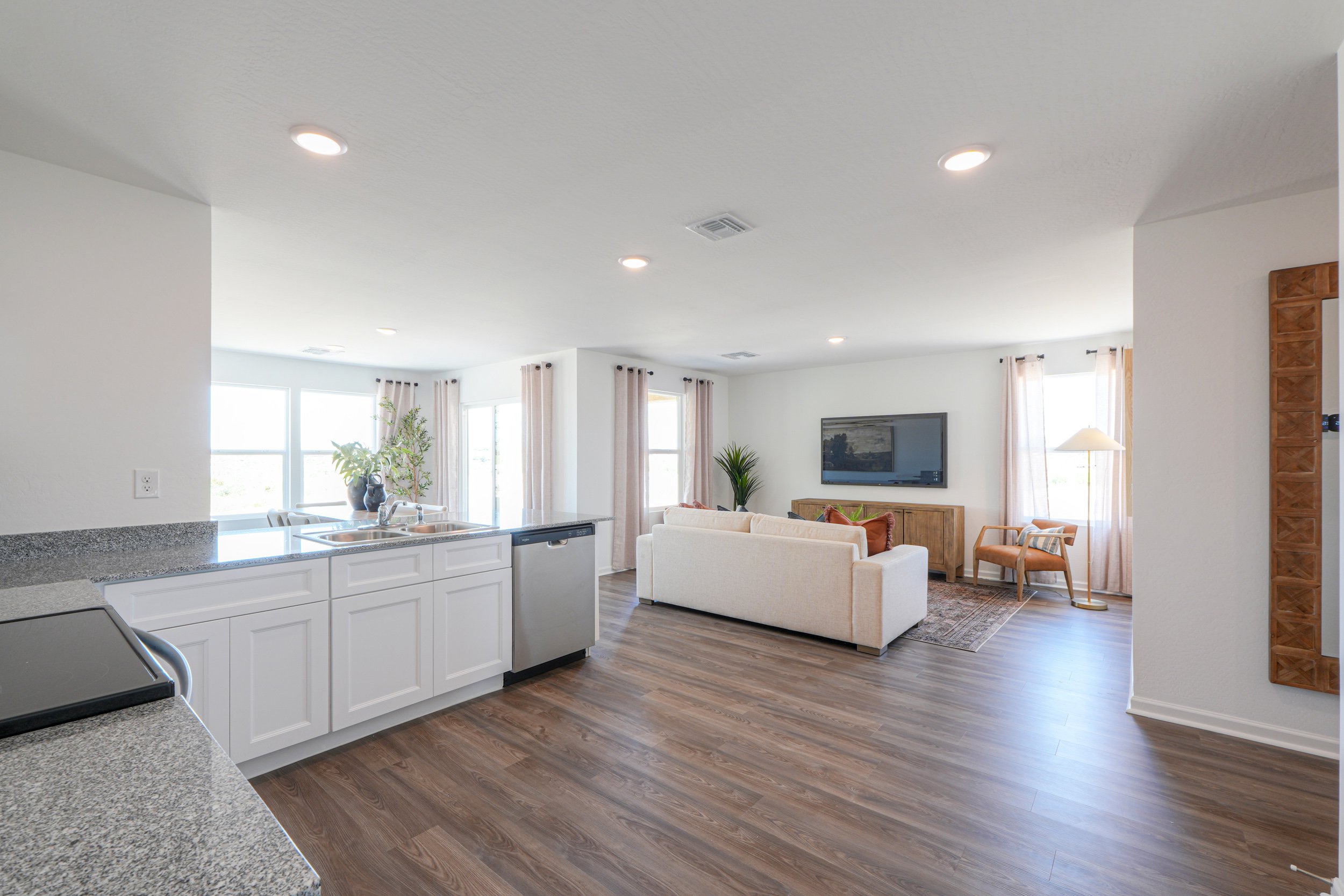 A living room with a large television.
