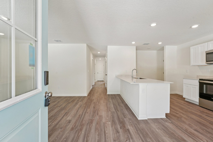 A large kitchen with white cabinets.