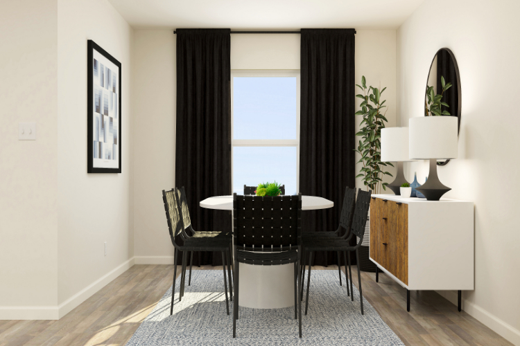 A dining room table with chairs.