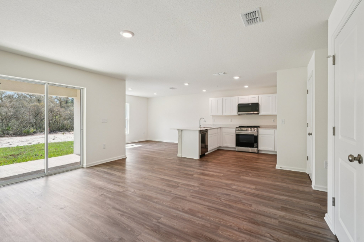 A large kitchen with white cabinets.