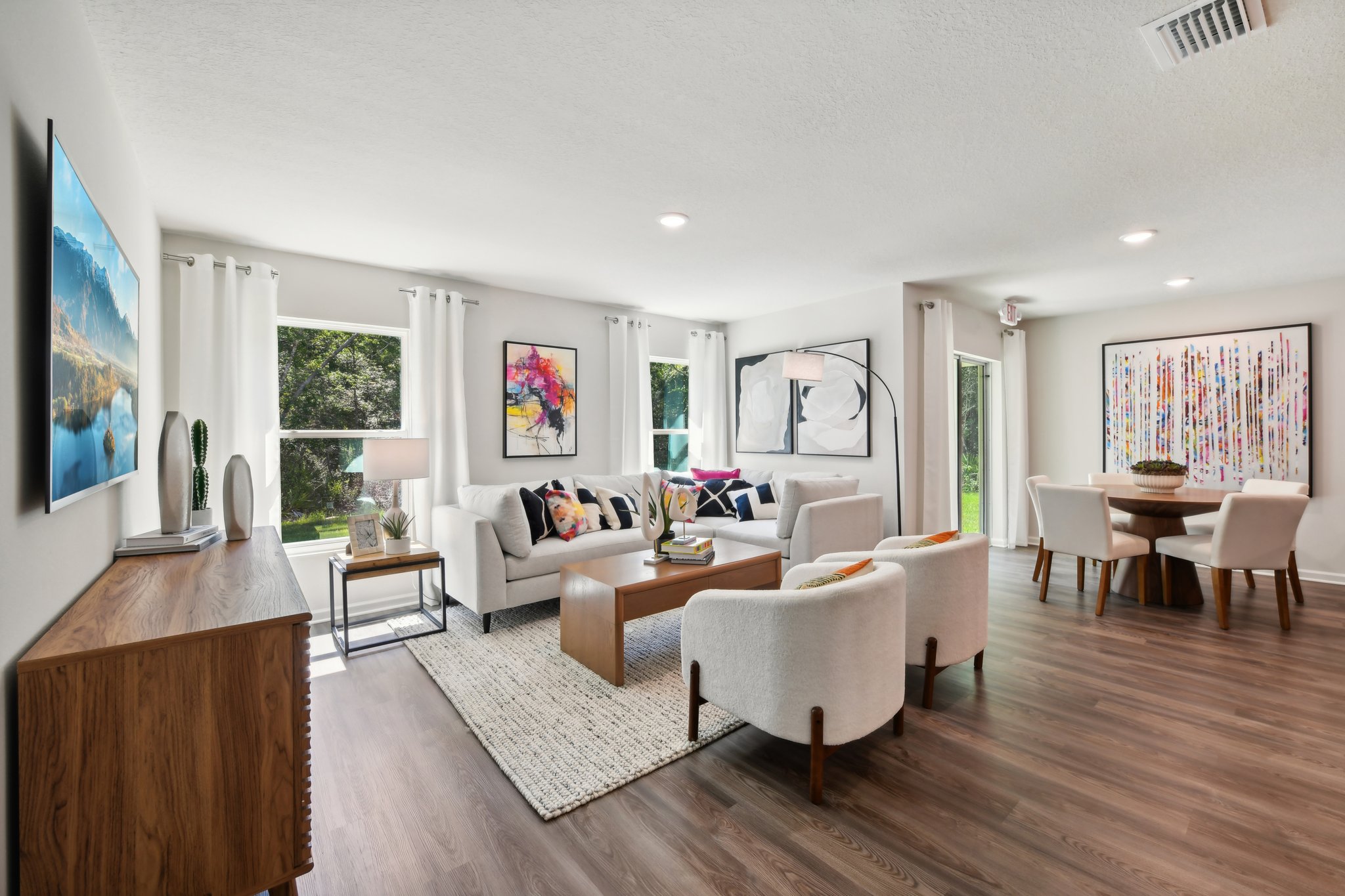 A living room with a large rug.