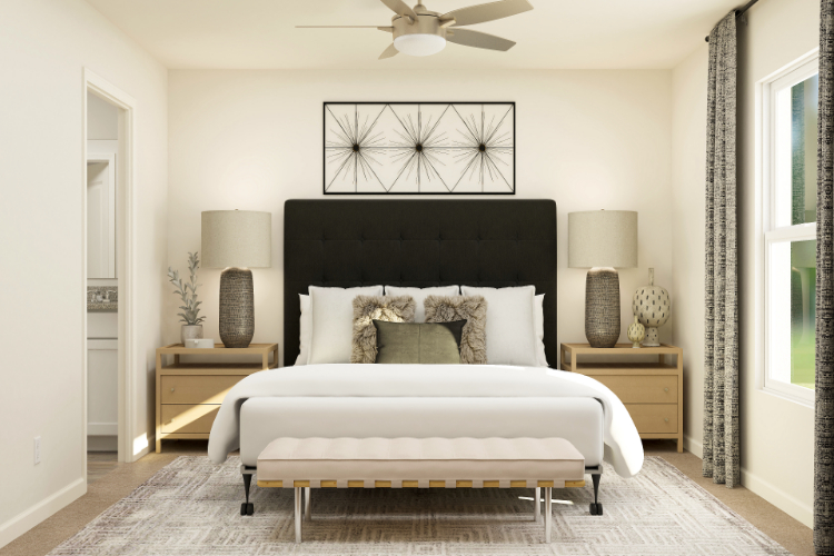 A bedroom with a bed and a table.