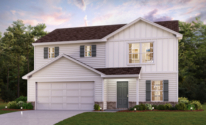 A white house with a garage.