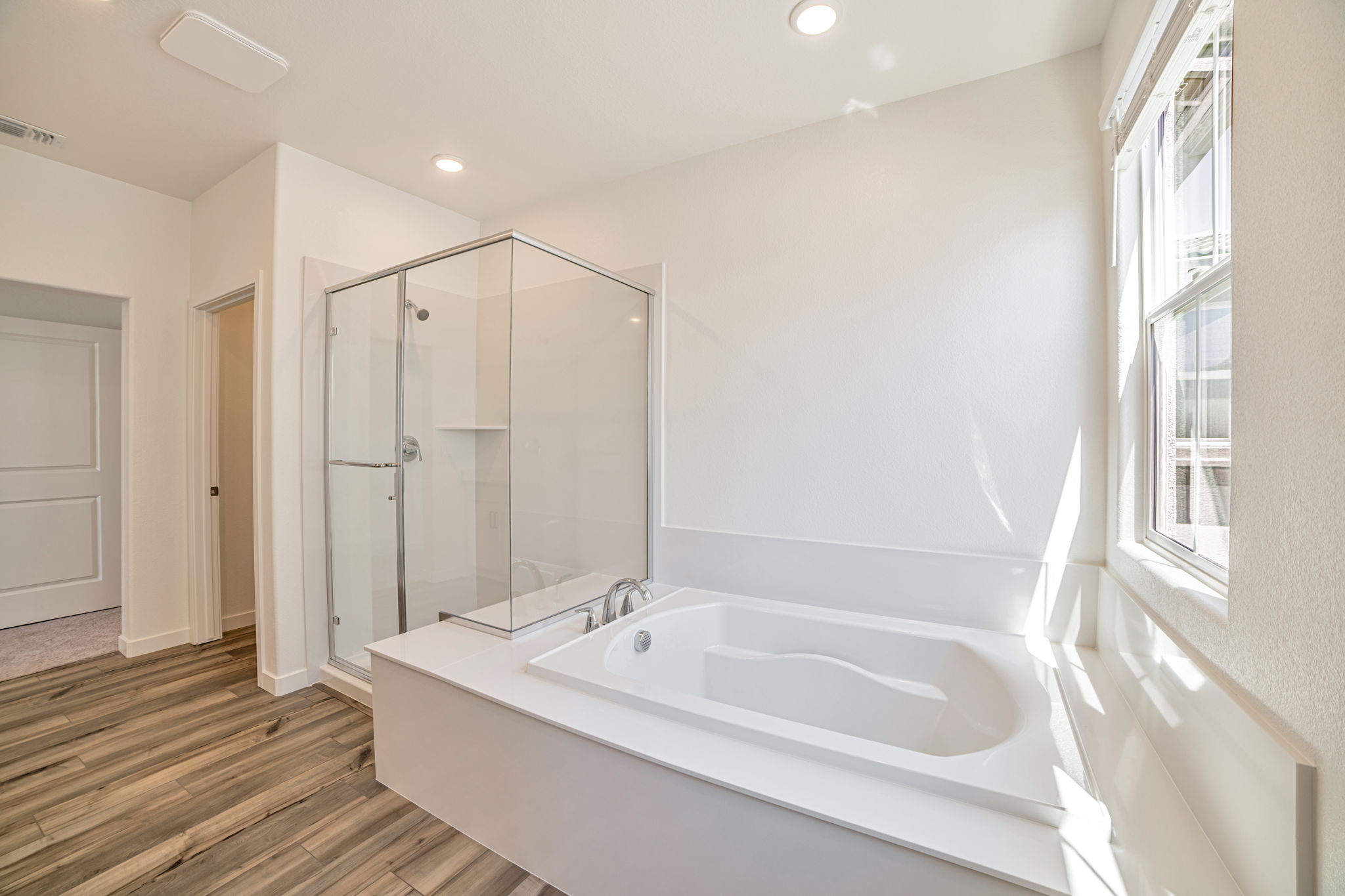 A bathroom with a tub and shower.