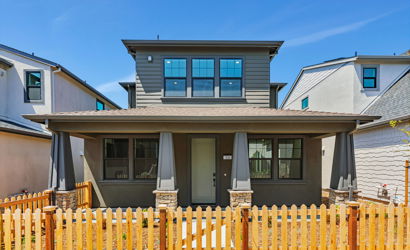 A house with a fence around it.